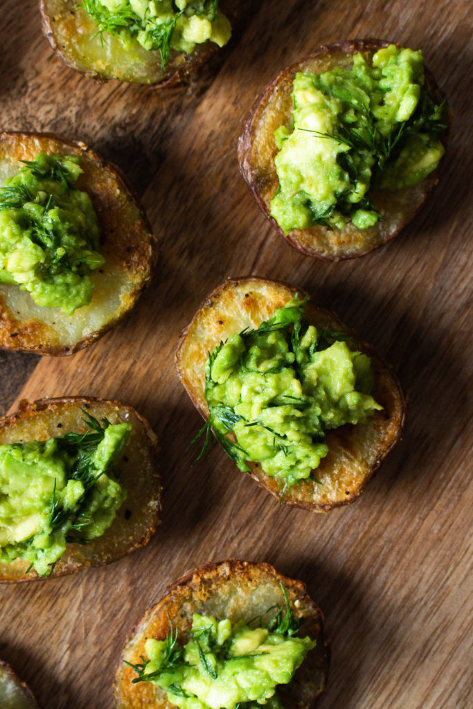 Finished crispy potatoes with avocado and dill