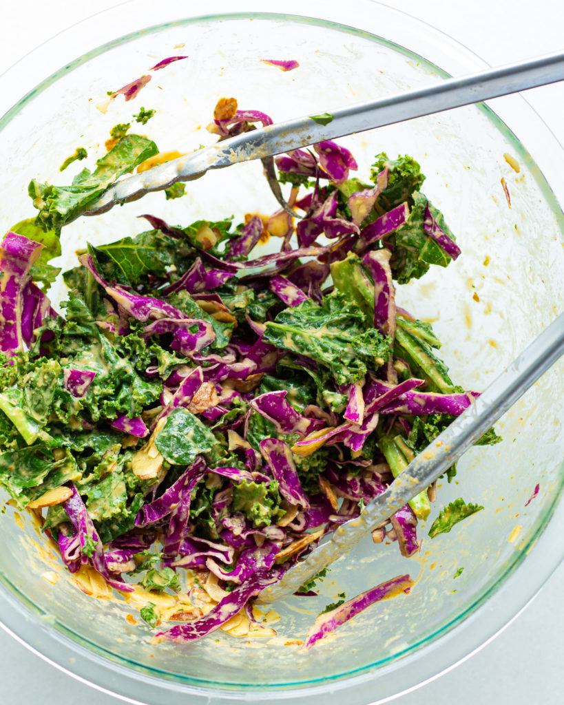 Spicy Kale & Cabbage Salad in mixing bowl