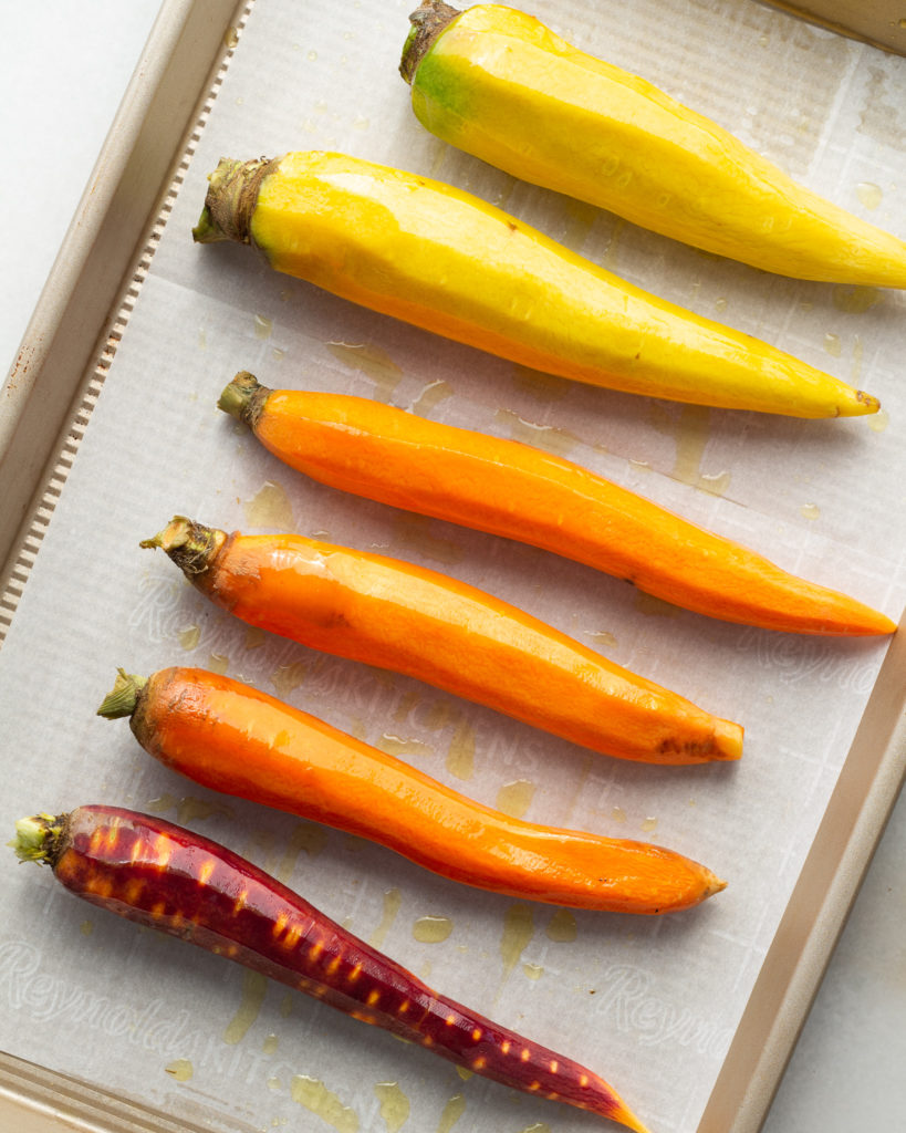 whole carrots coated in olive oil