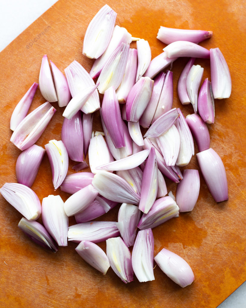Shallots, peeled and sliced in halves