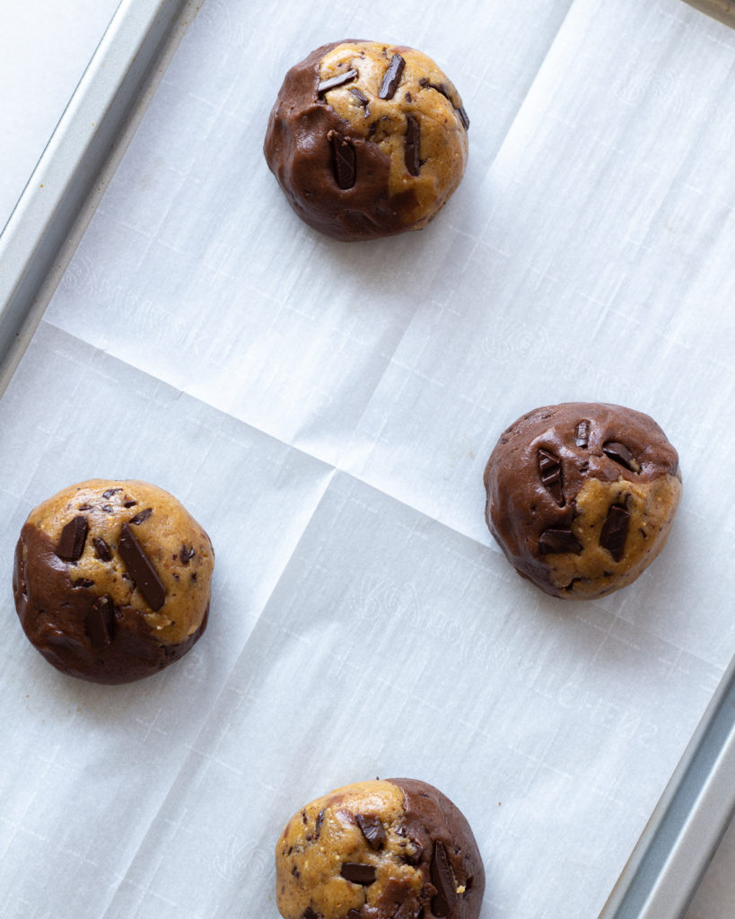 cookie balls on baking sheet