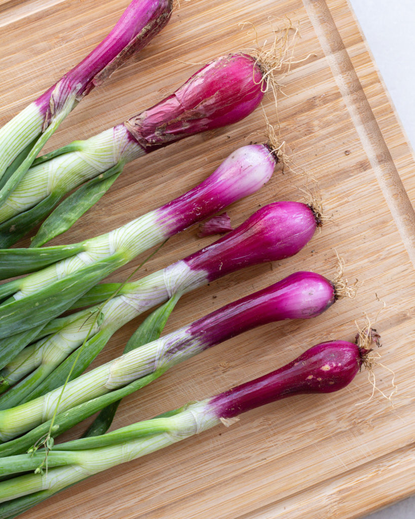 spring onions before they are cleaned and sliced