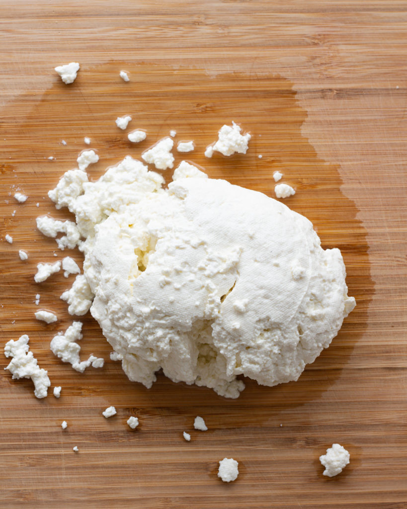 Curds on cutting board