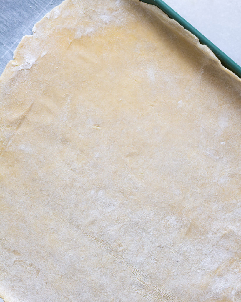 Dough rolled out, laying on baking sheet