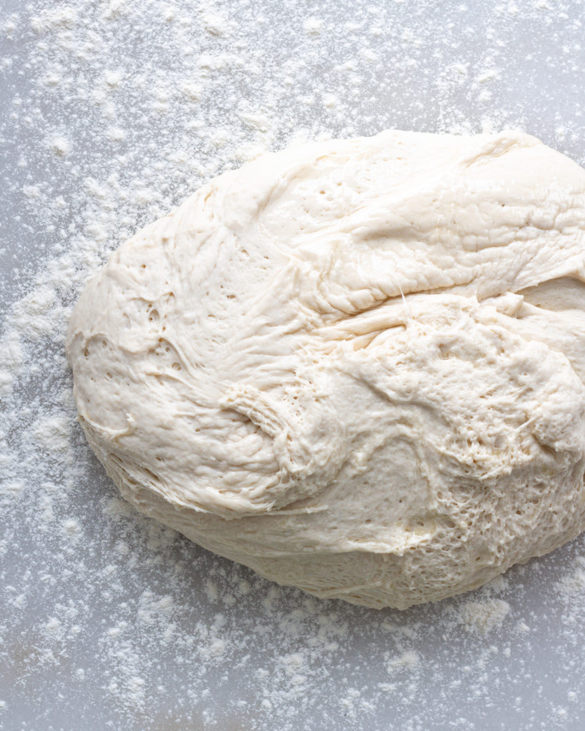 Ciabatta dough on floured surface