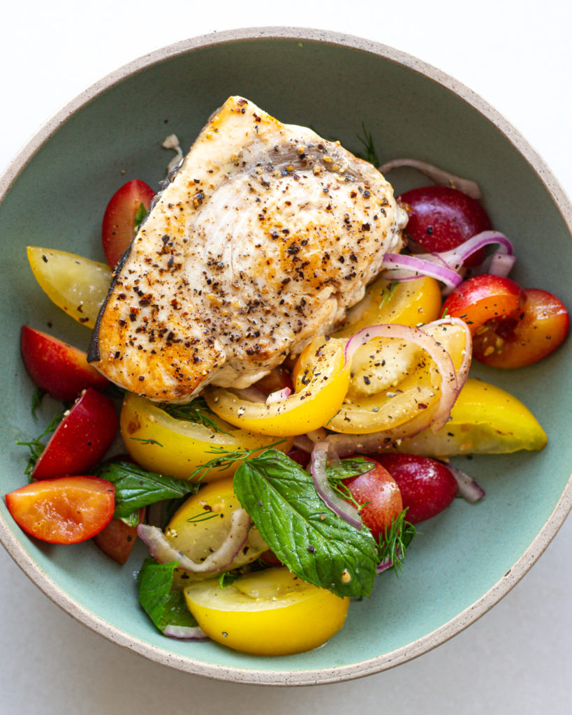Grilled swordfish added to tomato salad