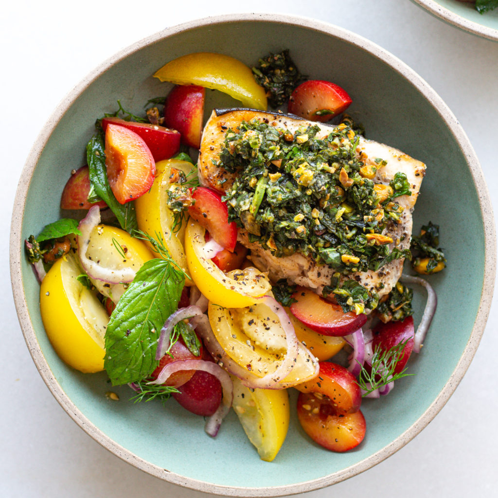 Finished Grilled Swordfish with Basil Pistachio Relish and Tomato Salad
