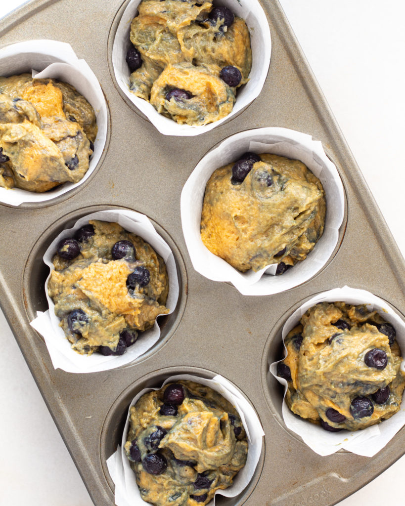 Muffin batter put into muffin tin