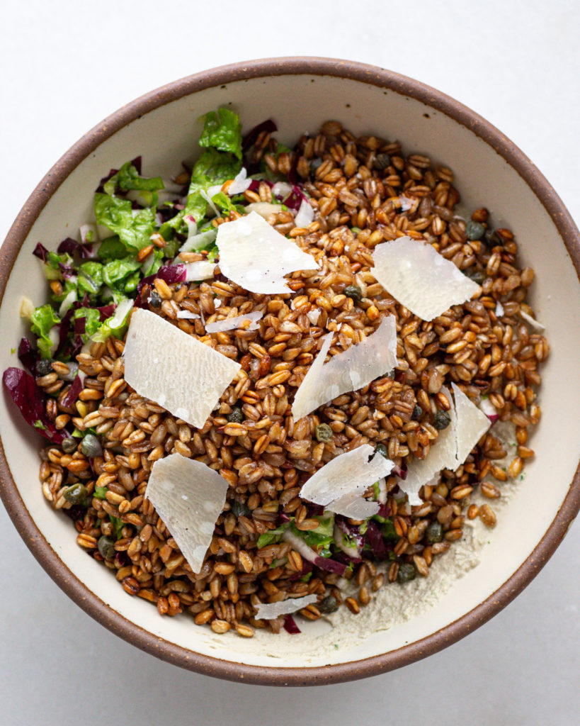 Finished crispy farro salad with shaved parmesan