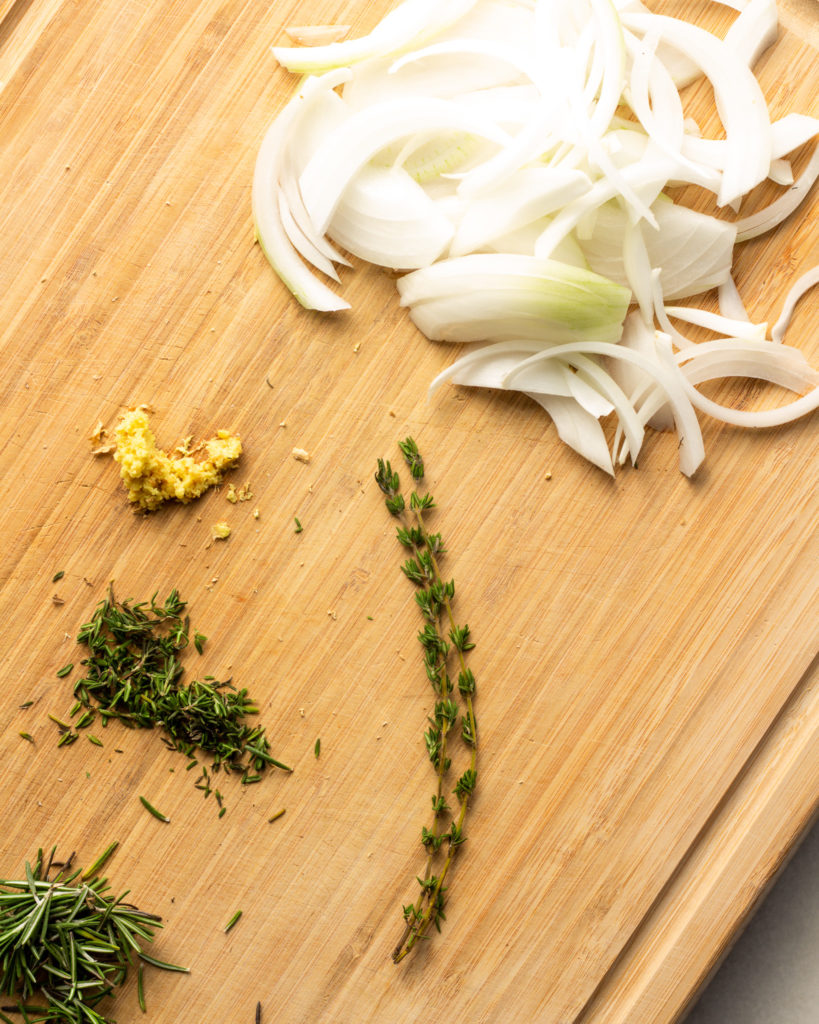 Fresh onions, grated garlic and ginger, thyme, and rosemary