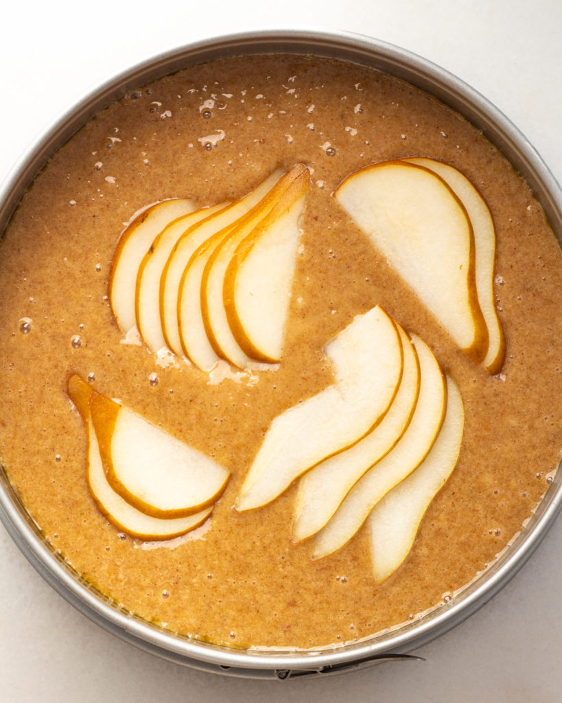 Final batter with sliced pears on top
