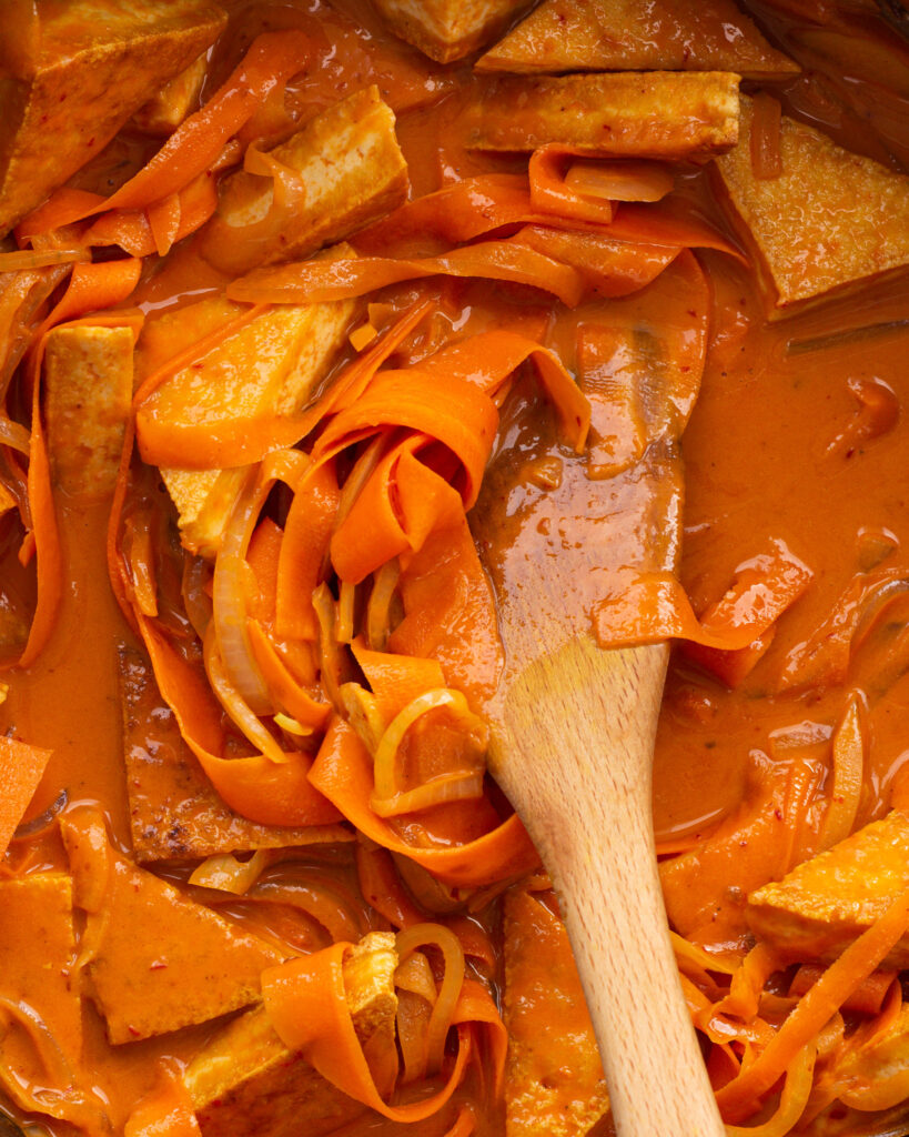 Chipotle Red Pepper Tofu and wooden spoon