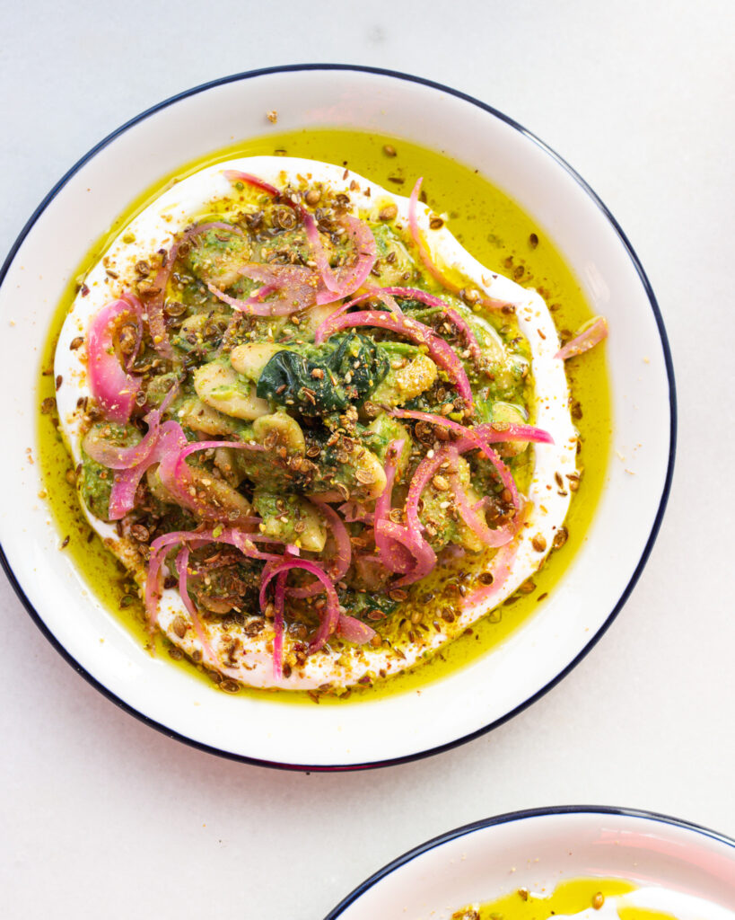 Preserved Lemon Zhoug Beans with Labneh in a bowl