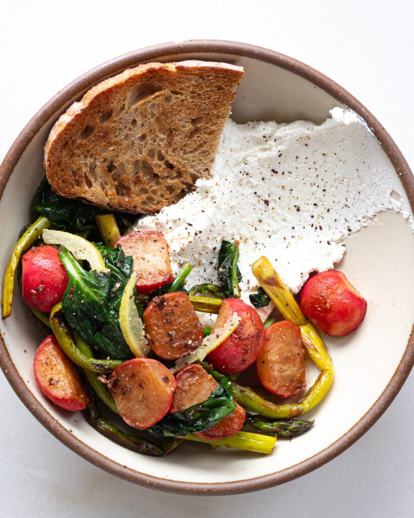 the completed charred radish and asparagus bowl served with toast