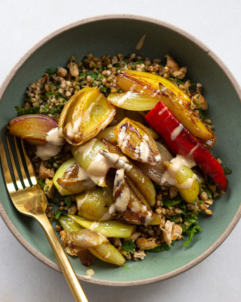 Turmeric shallots with crispy buckwheat and beans in a bowl