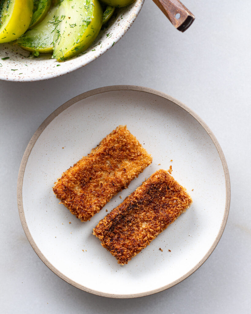 Two tofu cutlets on plate
