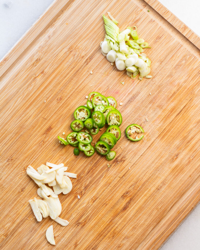 Sliced garlic, Serrano peppers and scallions