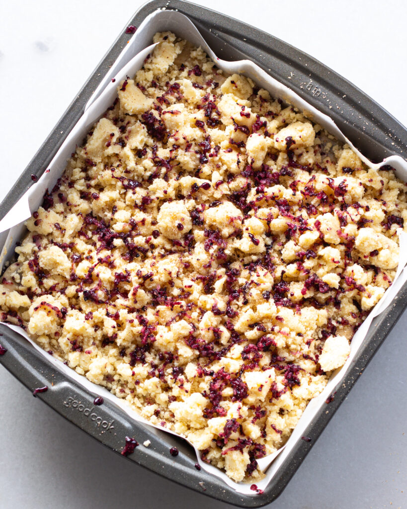 batter layered on top of blueberries