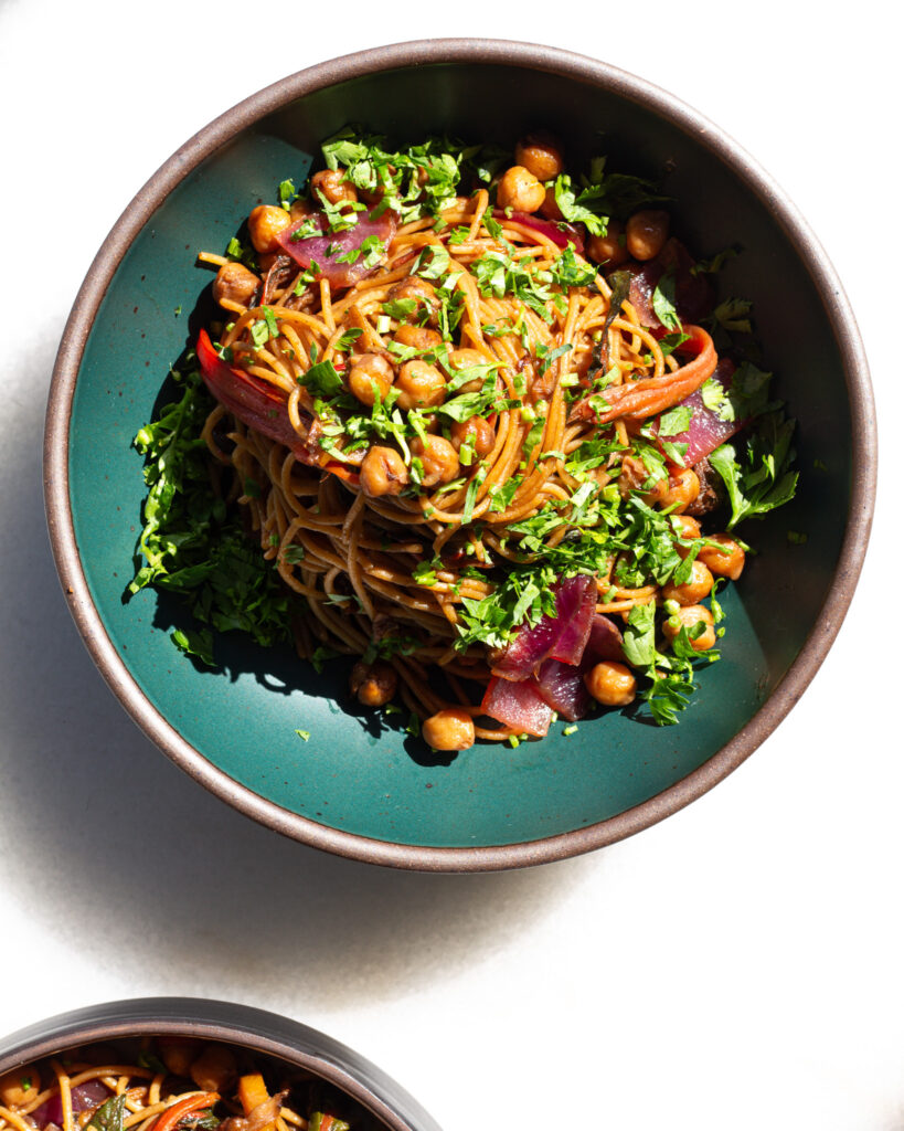 plated swiss chard spaghetti in a green bowl