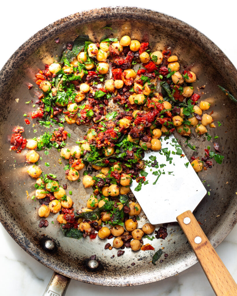 Chickpea filling featuring garlic, sage, kalamata olives, and sun-dried tomatoes.