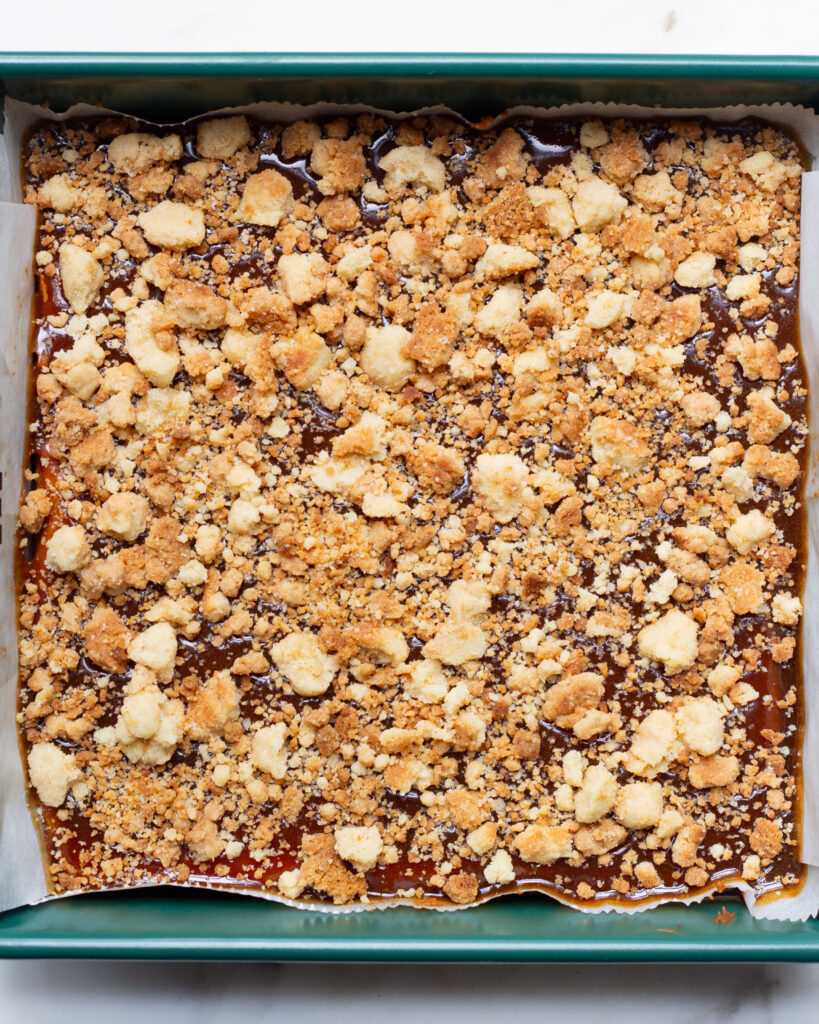 pumpkin bars with chai caramel and cardamom crumble in the pan