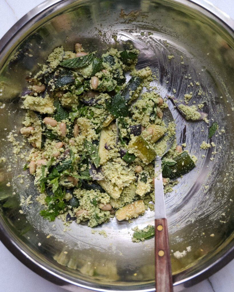 a mixed up green romesco couscous salad