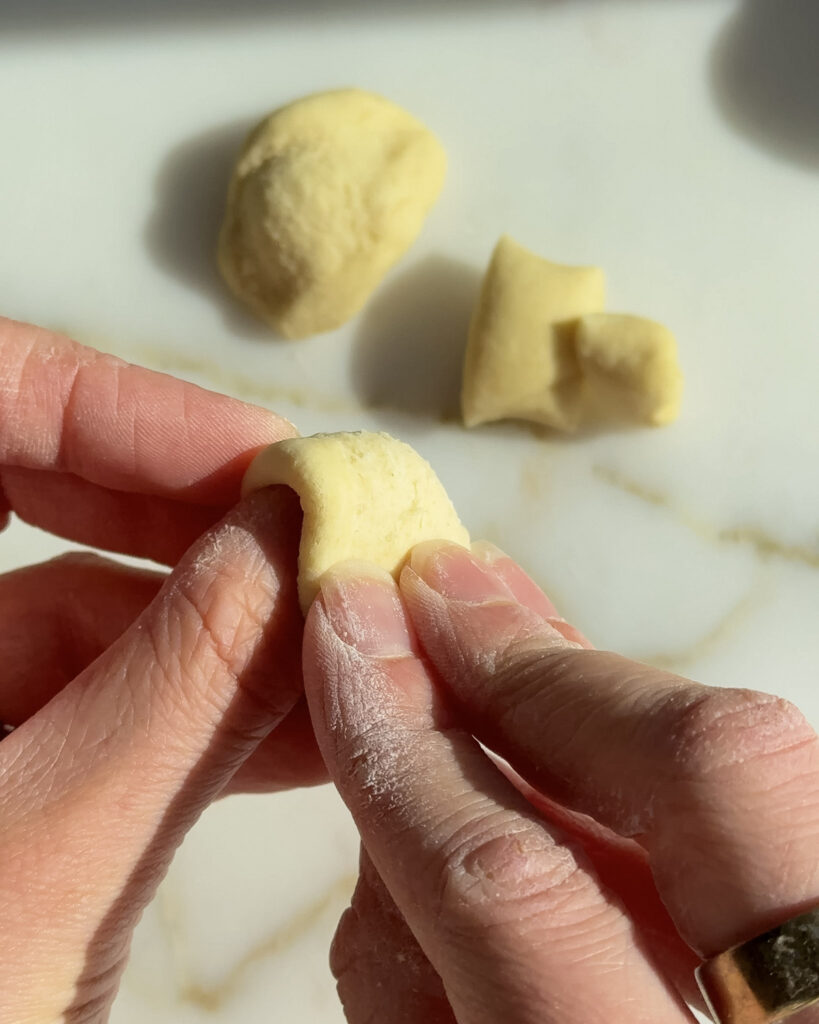 shaping homemade orecchiette by hand.