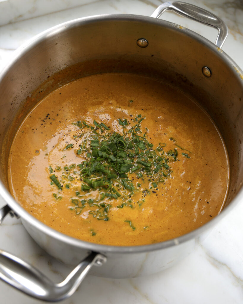 Carrot soup in a pot.
