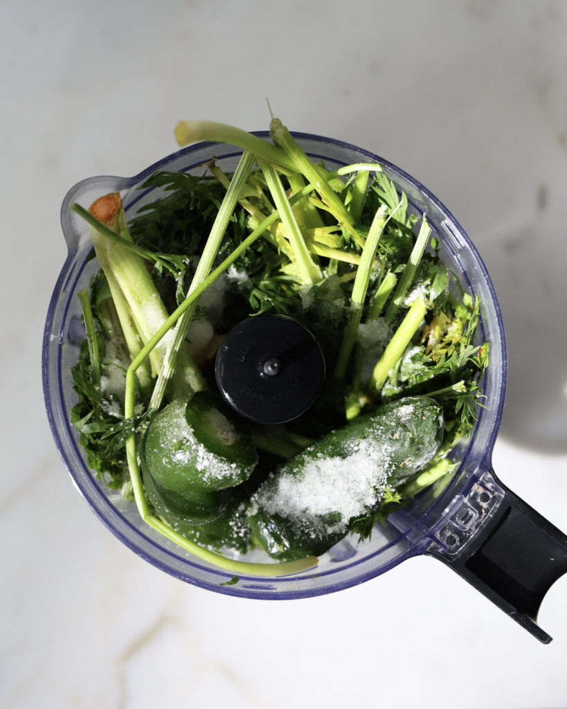 ingredients for carrot top hot sauce in a food processor