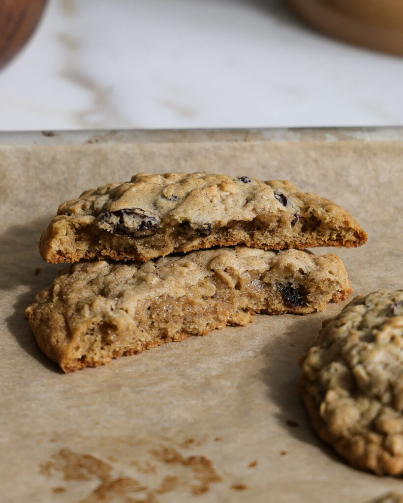 baked brown butter oatmeal raisin cookies cut in half.