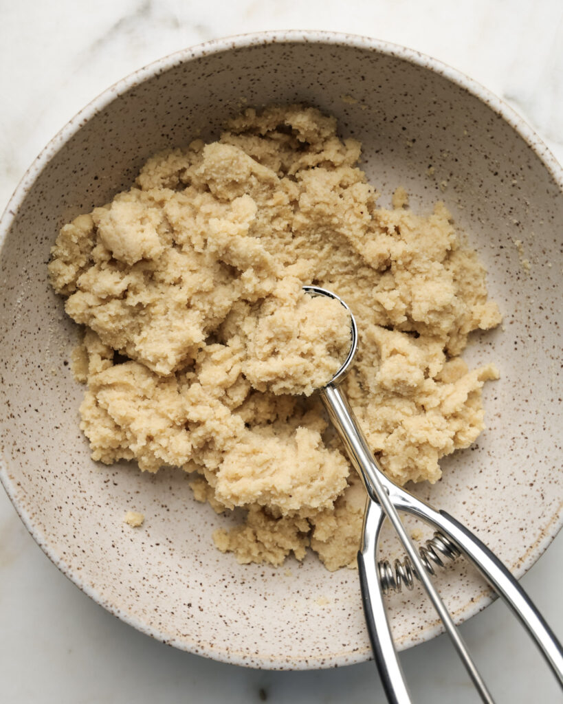 edible sugar cookie dough being scooped.