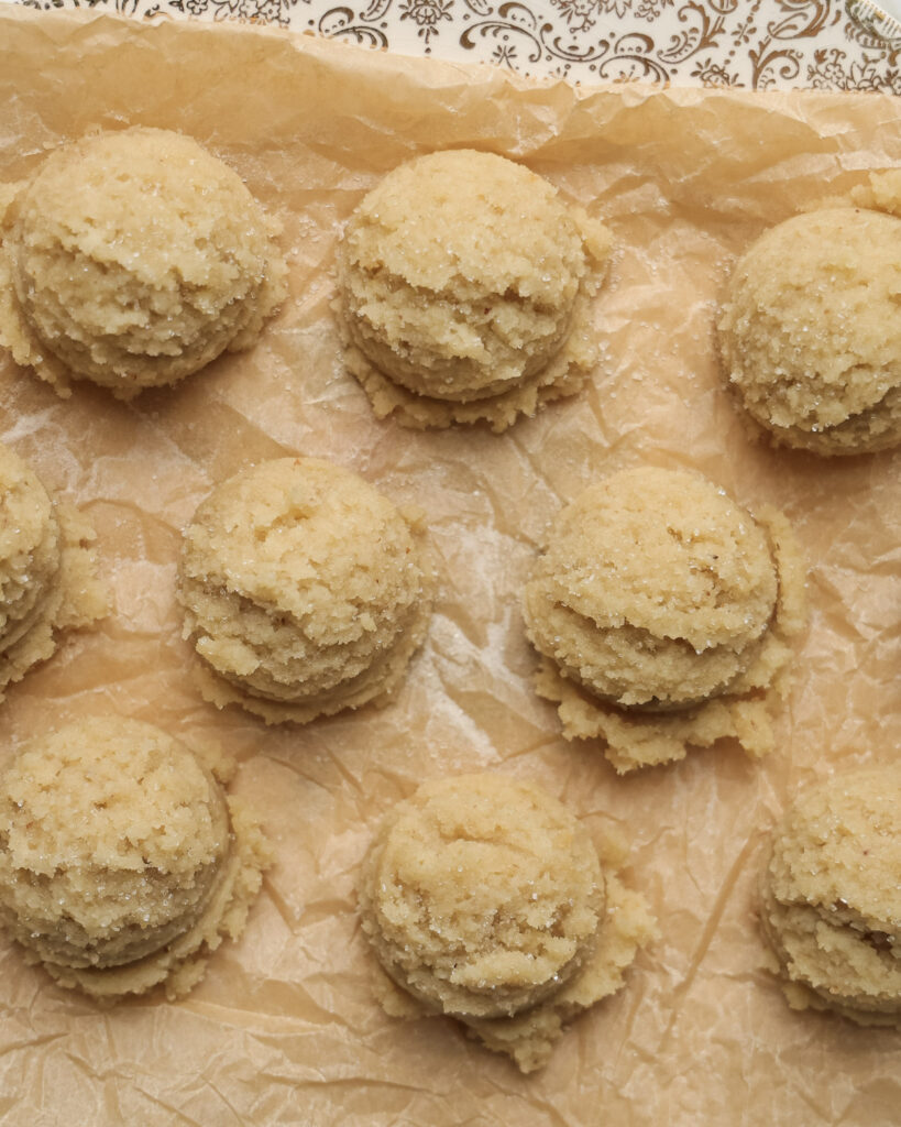 edible sugar cookie dough balls on a plate.