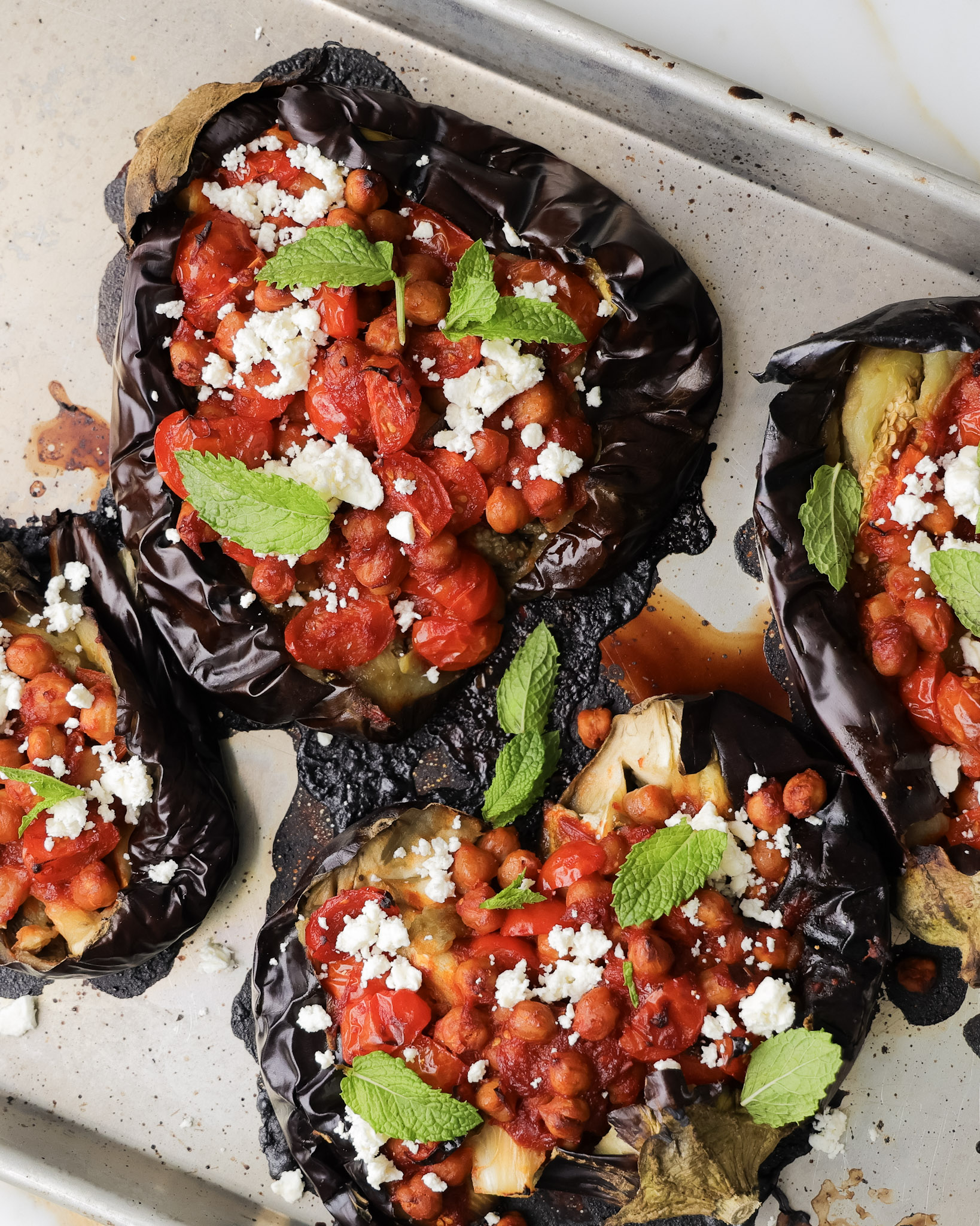 Grilled eggplant with harissa chickpeas on top.