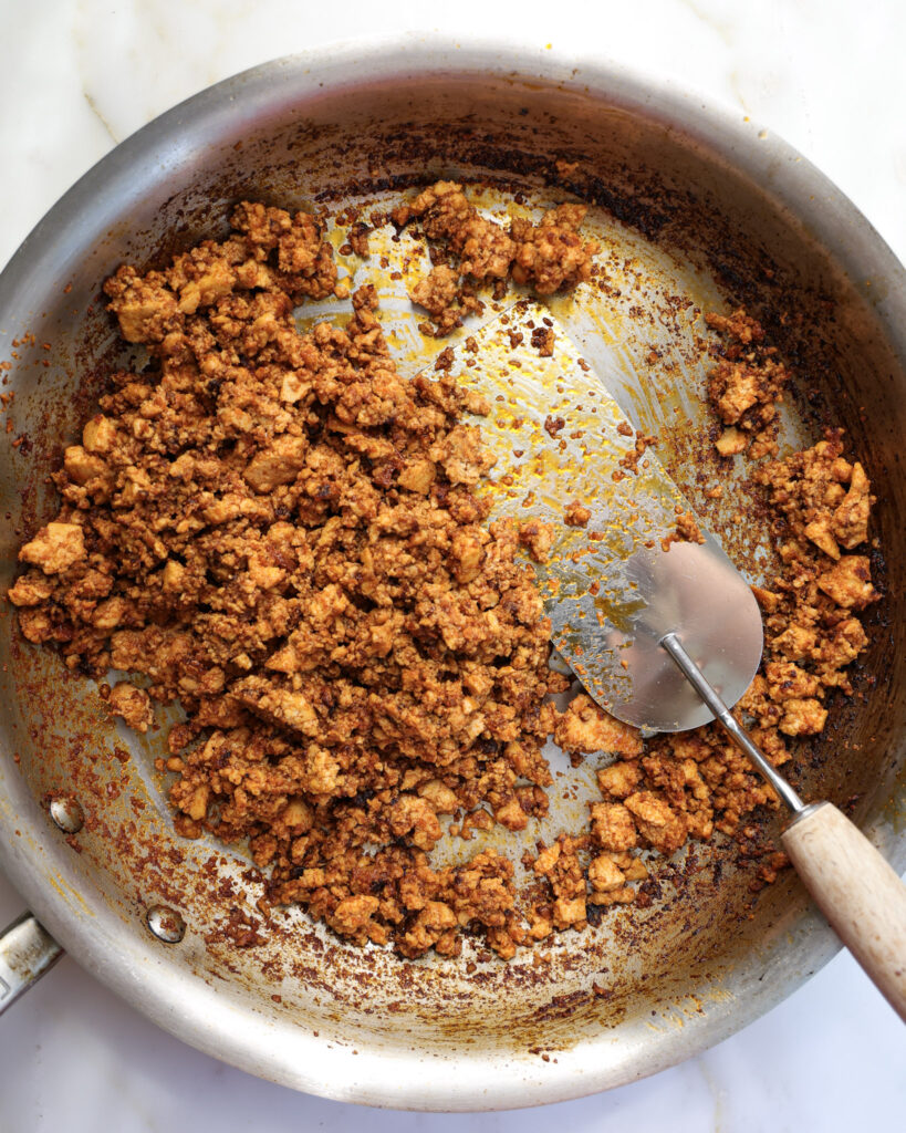 grund tofu being cooked in a pan.