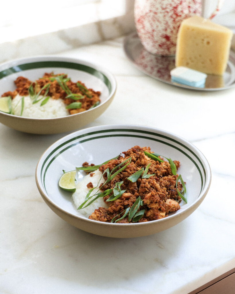 gochujang tofu over rice in a bowl.