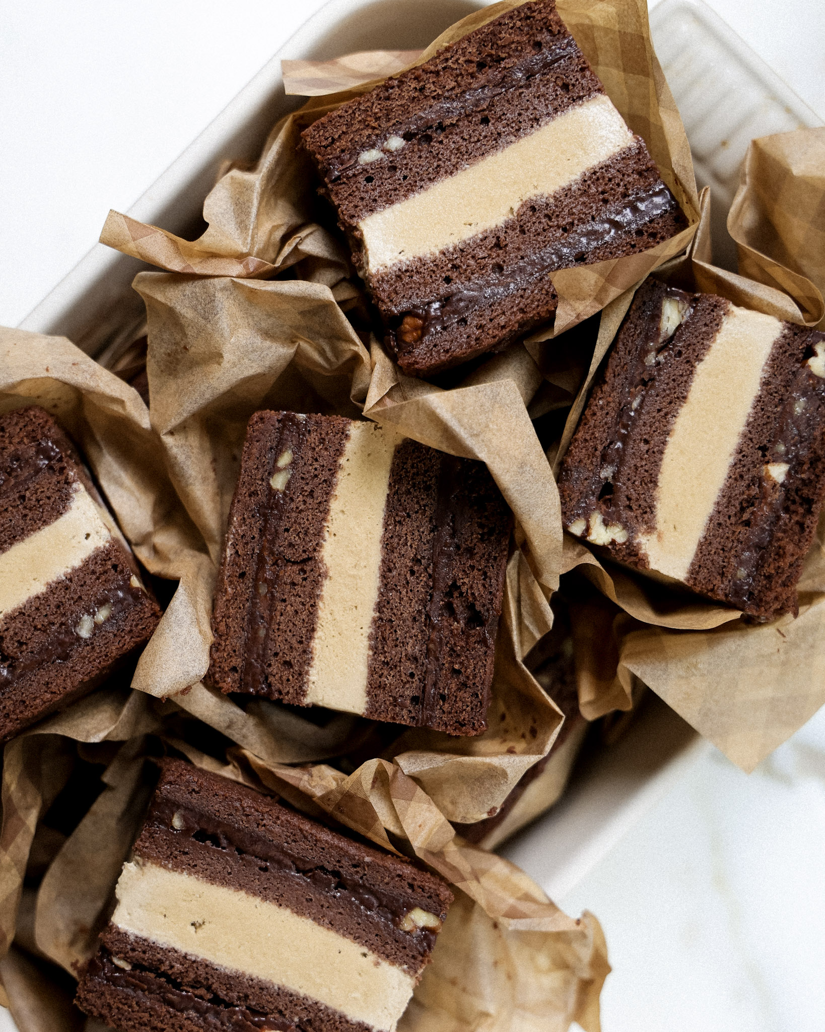 texas sheet cake ice cream sandwiches wrapped in parchment.
