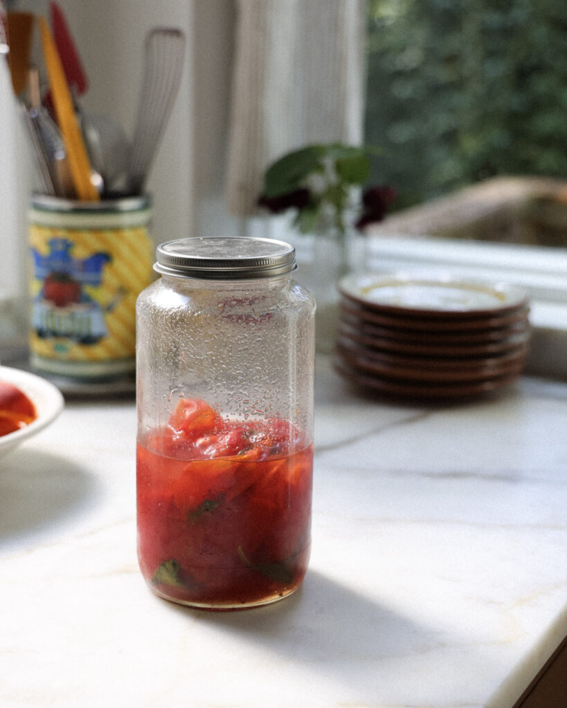 Pickled tomato skins in a jar.