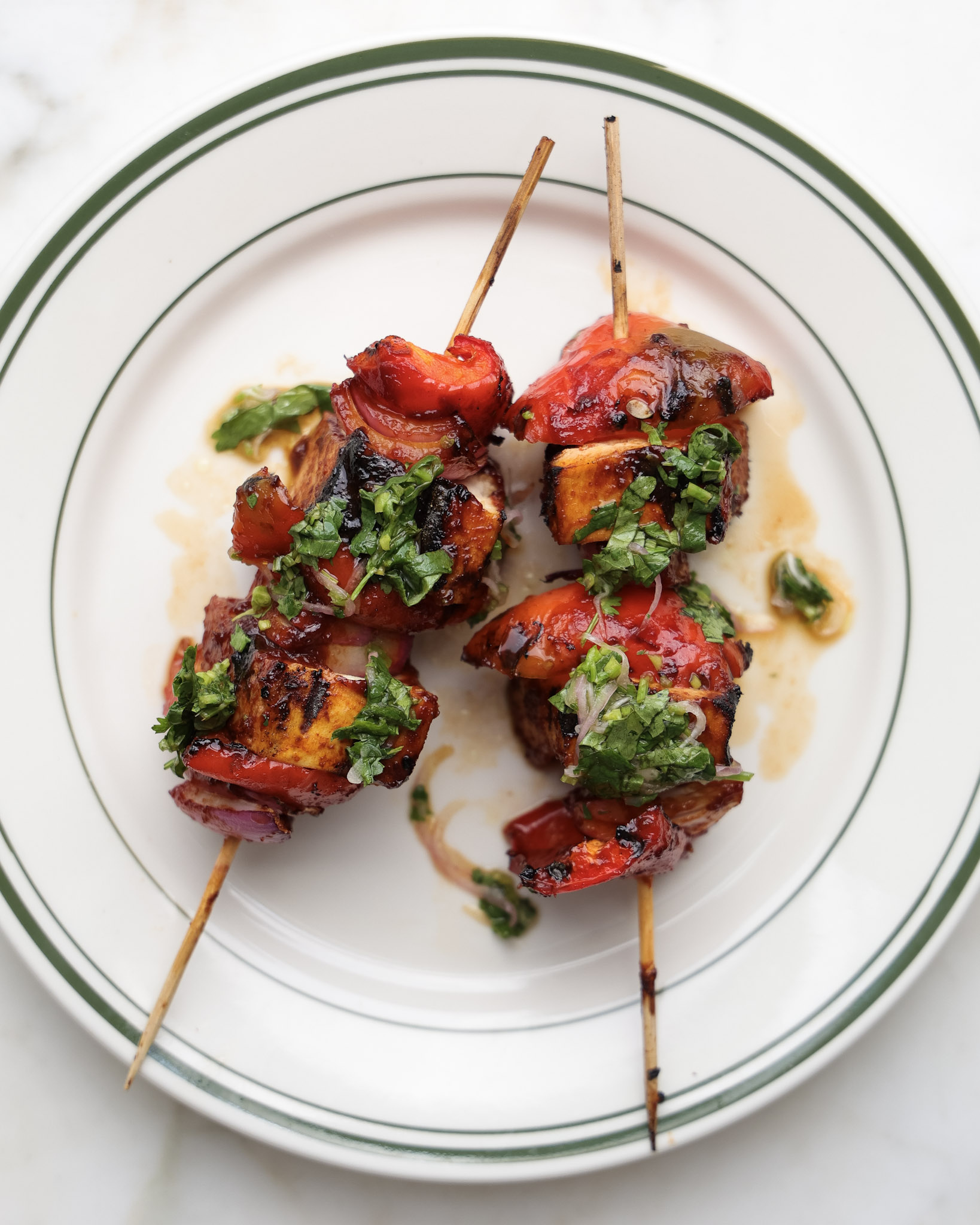 Grilled tofu skewers topped with cilantro shallot sauce.