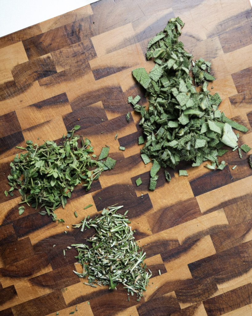 Chopped thyme, rosemary, and sage.