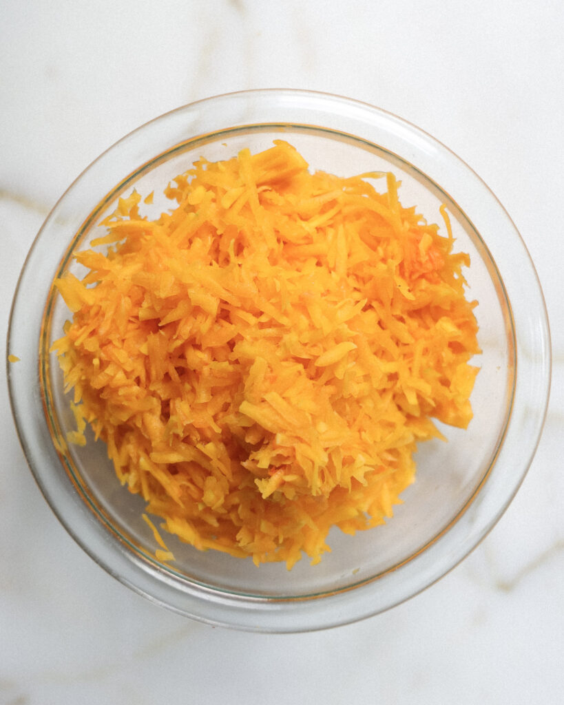 Grated squash in a bowl.